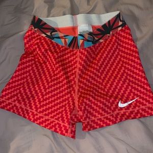 Orange and red Nike pro spandex shorts